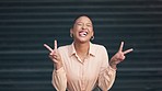 Happy, excited and smiling young woman posing with a peace hand pose. Cheerful female portrait of a positive person having a fun time. Carefree lady with healthy teeth posing and feeling playful.
