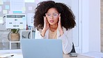 Stressed, frustrated and irritated young business woman suffering from a headache, migraine or mental fatigue. Corporate female working on a laptop at her office desk, struggling to meet a deadline