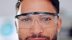 Happy, pleased and cheerful doctor wearing glasses while working in a lab for research. Closeup portrait of a satisfied, smiling and proud lab worker wearing goggles while working to find new cures