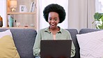 Smiling, excited and happy woman looking shocked, excited and surprised by good news while scrolling, browsing and typing on laptop at home. Lucky female winning a competition, deal or victory online