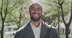 Teacher with a new job or career feeling positive and smiling on daily commute. Portrait face of a male professor looking positive and cheerful, enjoying success on his first day at a new university