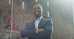 Motivated, inspired and confident business man with a vision, growth mindset and idea standing in a city in powerful and proud stance. Portrait of smiling manager, leader and boss with arms crossed