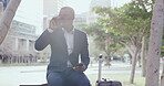 Business travel, commuting and global communication with a professional sending a text on his phone and drinking coffee in the city. Young man waiting outside, reading an email and checking the time