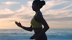 Fast, fit and active woman running by the ocean and beach shore with sunset sky background and copy space. Closeup of sporty female athlete exercising, endurance workout outdoors with a scenic view.