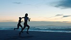 Fitness, exercise and healthy fit women running along the ocean coast. Females competing, exercising and doing cardio. Endurance and stamina for health and wellness in the outdoors.