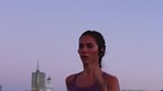 Fitness woman sunset running in urban city for cardio training, marathon sports and healthy exercise outdoor. Focus runner, strong body and young athlete with motivation, power and challenge at dawn