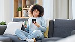 Browsing, reading and texting on phone while relaxing, drinking coffee and sitting on a home living room sofa. Beautiful, serious and relaxed afro woman checking social media and joining dating apps