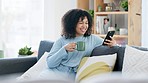 Browsing, reading and texting on phone while relaxing, drinking coffee and sitting on a home living room sofa. Beautiful, laughing and happy afro woman checking social media and joining dating apps