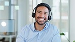Businessman on a video conference call, virtual meeting or online consultation wearing headset in the office. Happy face of a call center support agent looking at the camera during a global webinar