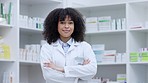 Medical doctor, worker and professional nurse standing with arm crossed, looking proud and confident while working at a pharmacy. Portrait of black female employee smiling, looking cheerful and happy