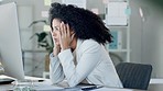 Stressed and tired businesswoman with headache looking at screen in office. Exhausted employee struggling to finish a work task. Pressure and worry at work resulting in health problems