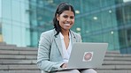 Confident, happy and professional corporate worker replying to emails on laptop while relaxing outside. Portrait of smiling Latino enjoying browsing the internet, taking a break outside of the office