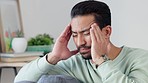 Stressed, worried and anxious man with headache, grief and problem in pain. Tired, sad and frustrated guy feeling sick, ill and unwell from chronic migraine, depression and unhappy in mental distress