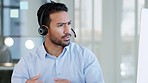 Annoyed, busy and serious businessman in a video call meeting talking and checking notes during a difficult, rude or important conversation. Virtual global corporate worker working with a headset