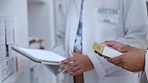 Pharmacists scrolling, browsing and planning on digital tablet while counting, sorting and ordering new stock in drugstore. Closeup of organised healthcare staff checking inventory of medicine online