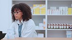 Professional female pharmacy consultant works and types medication stock inventory on pc computer in modern drugstore. Clinical healthcare pharmacist working on customers medical prescriptions  