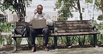 Business man talking on phone call, spilling coffee on laptop and dropping pc while working on a bench in a nature park. Male entrepreneur making conversation and having an accident with technology