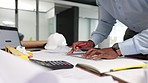 Professional civil male engineer doing a drawing for a project at his desk in his modern office. Construction manager working on architect blueprint plans. Industry worker working on a sketch design.