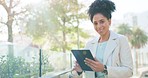 Business woman working on tablet in city, typing email on 5g technology and networking with international people on on the internet online. Face portrait of Brazilian corporate employee with smile