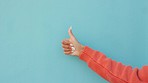 Thumbs up, thumb or hand of woman on blue studio background mockup. Success, successful or symbol or girl approval, encouragement and motivation or goal, ok and thank you or agreement copy space.