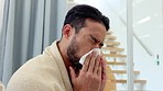 Sick, covid virus or allergy man with cold, flu or sinus in living room home. Young alone guy with bad healthcare insurance, fever symptoms or coronavirus disease sneeze into tissue and rubbing nose