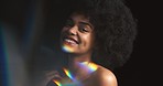 Prism rainbow, light and reflection on a woman model from Jamaica with a happy smile. Portrait of a person with colorful creative lighting on her face, teeth and body skin feeling the beauty of art