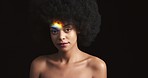 Prism rainbow, reflection and light on a black woman model in a creative, art and lighting installation. Portrait or a calm female face modeling in colorful creative art lights in a black background