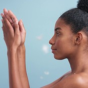 Nude black model with soft skin, feather art fall against blue backdrop happy or show satisfaction with smooth body. Young African woman smile, flawless face and healthy skin tone against background. | Buy Stock Photo on PeopleImages, Picture And Royalty Free Image. Pic 2515970 - PeopleImages