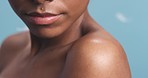 Body natural skincare, black woman beauty and blue background with bare shoulder. Smooth dark skin, nude soft arm luxury spa wellness, clean and healthy model cosmetic product ad closeup in studio