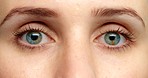 Blue eye woman, blink eyelid in zoom portrait of shock or sad face. Young Caucasian lady, with turquoise color eyes and healthy skin, in macro view with expression of fear or anxiety.