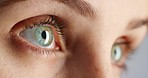 Eye, eyesight and vision of woman with green eyes and blinking during a test at the optometrist or optician. Closeup detail of female testing for optical prescription, eyewear or contact lenses