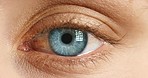 Focus, blink and sight with blue eye closeup of woman for vision, iris or retina awareness and health. Optometry, cornea and optical with zoom in on eyeball for eyesight and natural wellness