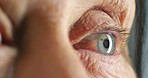 Senior eyes, focus and eye exam of a elderly person doing vision test exercise to check for glaucoma. Blue iris and cornea damage health examination at a optometrist to fit a old patient for glasses