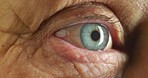 Vision, health and the eye of a senior woman closeup and cropped. Healthcare, medical insurance and laser surgery for bad eyesight in retirement. Tired eyes of an elderly grandma looking and watching