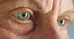 Eye, vision and healthcare with the eyes of a senior man during an appointment with an optometrist or optician. Medical, insurance and wellness with an elderly male testing his eyesight for eyewear