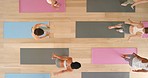 Health, exercise and yoga stretching during a workout in a studio or gym from above. Meditation, balance and posture with young, flexible athletic women practice zen and inner peace training together