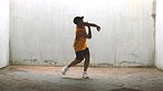 Hip hop, dance and crazy energy of a man dancing for fitness, exercise and workout outdoor. Person with fast feet cardio training for a dancer performance with motivation, passion and body movement