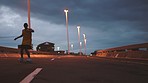 Energy, freedom and dance in street by man silhouette practice move and routine on highway. Energetic, fit and flexible guy freestyle dancer with trendy hip hop style movement enjoy city night life