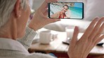 Senior, video call and mother talking to a daughter on vacation with phone communication at home. Family mobile conversation of a woman on a beach while a mom wave on technology on a house couch