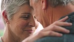Love, forgive and elderly couple hug and bonding in home together, sharing affection and a sweet moment. Sorry, care and romance by mature man and woman embracing and being loving closeup of console