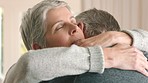 Sad senior couple hug, gives support and love after hearing bad news leaving them depressed. Elderly caucasian woman providing comfort, care and empathy after cancer diagnosis as they stick together