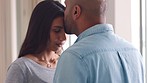 Love, support and trust with a couple hugging in comfort, care or to console one another after loss, grief and pain. Kiss, affection and safe with a woman embracing her man in their home together