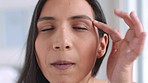 Skincare, beauty and face of a woman touching her skin while looking at herself at home. Closeup portrait of a happy, smile and young lady with a healthy facial treatment routine getting ready.