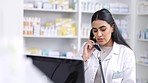 Pharmacist talking on telephone, computer and help customer service for prescription medicine, retail healthcare and medical pills. Young woman speaking phone call in pharmacy, chemist and drugstore