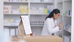 Pharmacy, medicine and paper bag with pharmacist working on inventory for medical, healthcare or insurance receipt. Pills package on table for doctor trust, commercial retail service or courier stock
