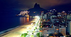 Coastal cityscape, timelapse and beach with city buildings in a popular tourist and vacation destination in Rio, Brazil during night and day. Mountain, skyscrapers and scenic landscape by the coast 