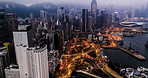 Fast highway traffic, aerial night cityscape street and busy road in skyline buildings, transport development and speed moving networking. Above global business district and infrastructure connection