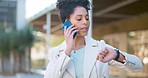 Business woman talking on phone call, waiting for ride in urban city, planning, checking the time and schedule. Happy African American female smiling outdoors, focused and punctual on daily commute