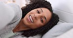 Face portrait of woman in bed in morning, kissing gesture with mouth and talking after sleeping in bedroom. Funny, happy and relax African girl with energy ready to wake up with head on pillow