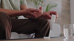 Man, water and medicine pills in house living room or home interior for health wellness, sick or spring allergy. Zoom on hands, drink glass or healthcare drugs product for covid, flu or medical virus